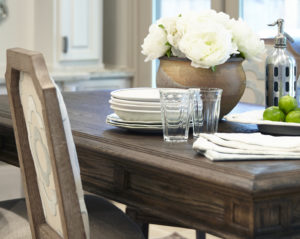 Natural Wood Grains in this Table and Chair Back Contribute to the Focus on Natural Elements in the Room