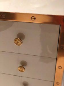 Brass drawer pulls on chest of drawers