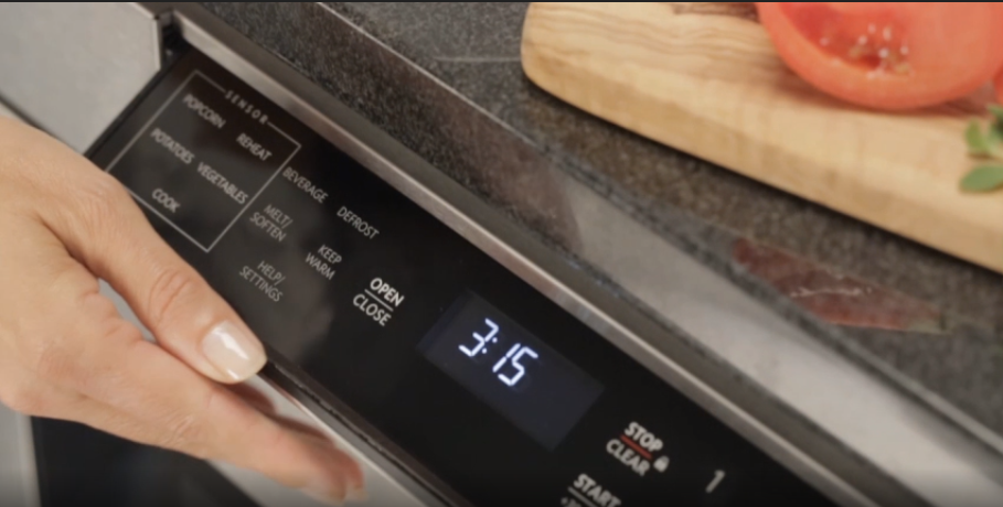 Under-counter microwave that has a display that opens upward at a 45-degree angle for easy viewing