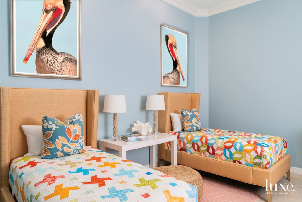 Pelican art and quilts in guest room