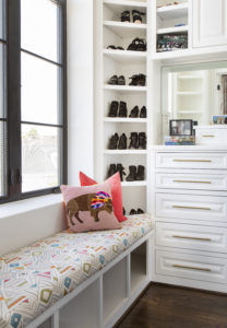 A custom bench cushion adds to the comfortable use of this client's closet.