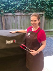 Pamela O'Brien sports her PHD apron that's ideal for grilling.