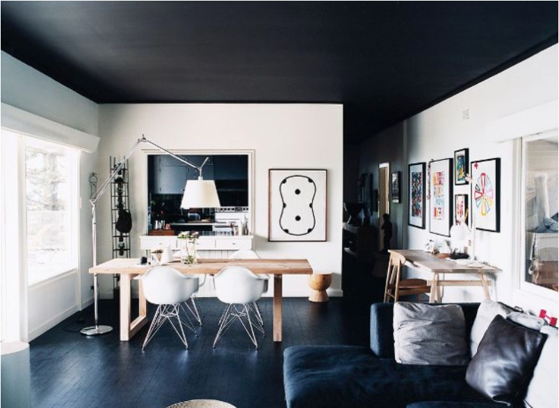 Dark paint on a ceiling in this home office gives a modern vibe