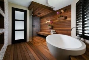 Natural textures and dark wood hues polish this home spa