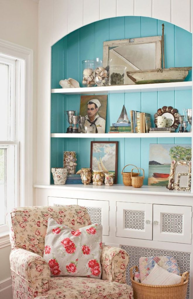 add a pop of ocean blues and greens to a bookshelf to incorporate summer into home décor