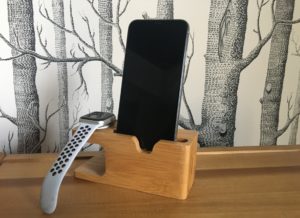 bamboo watch and phone charging station minimizes phone cords