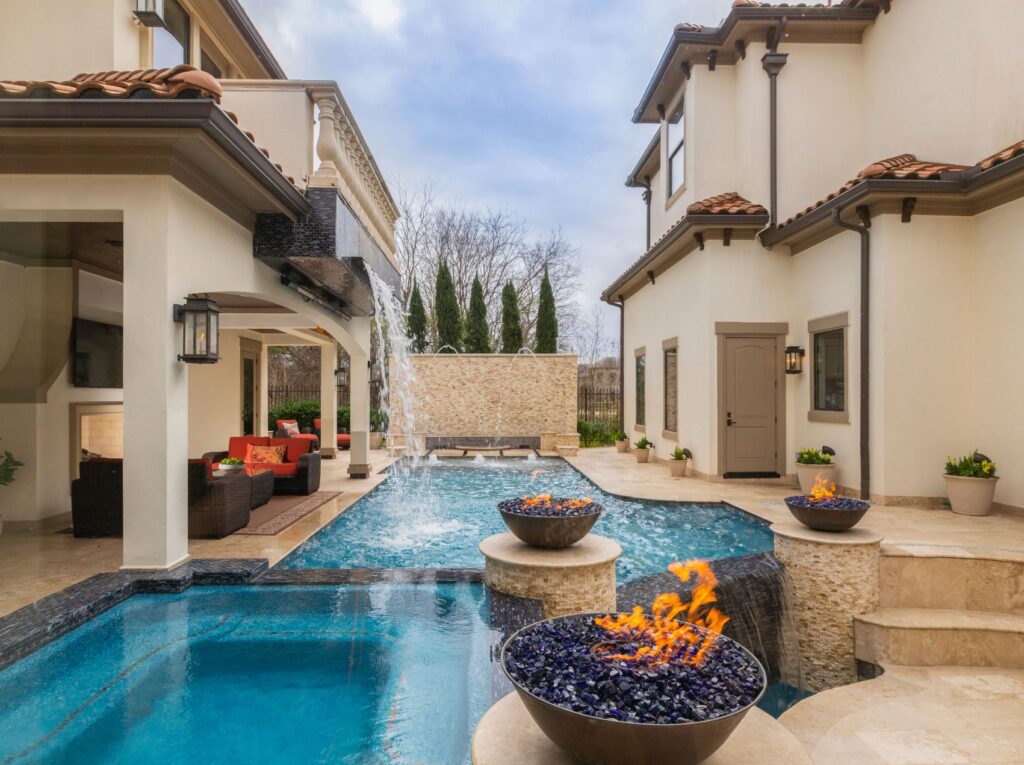 outdoor living with waterfall pool in Richmond TX