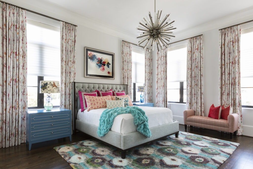 A bedroom with lots of patterns and colors that create a comforting space to sleep.